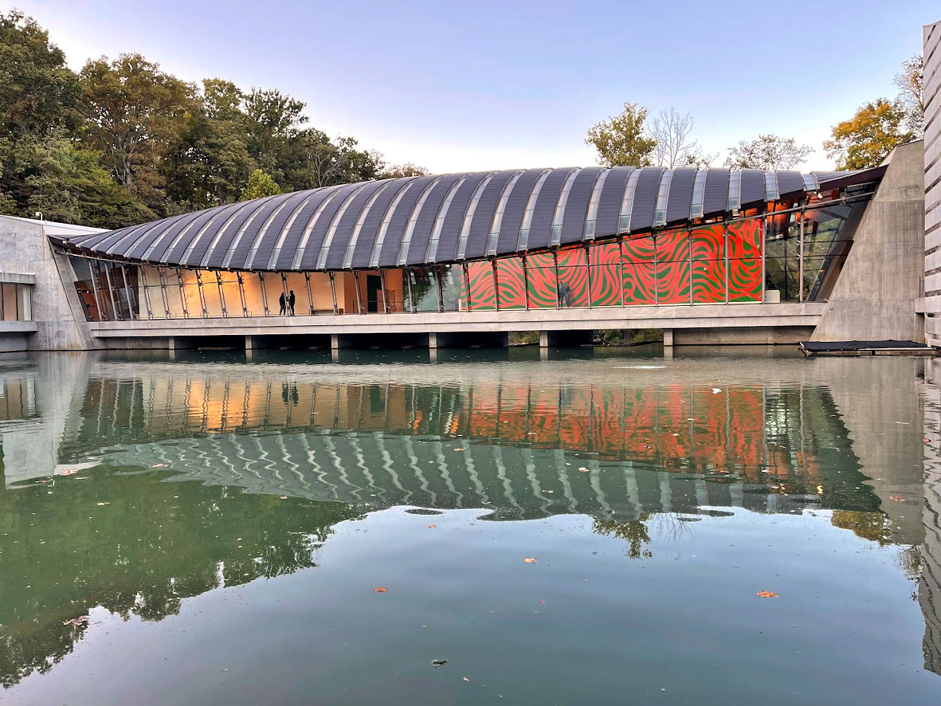 View of the main pavilion, featuring glass walls and steel support structures.